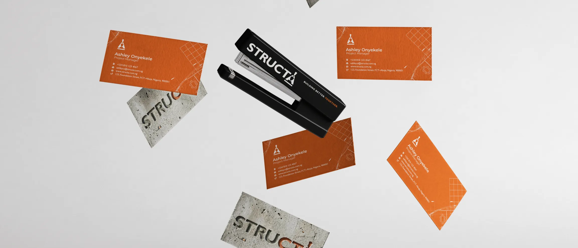 Structa business cards and branded stationery arranged on a pale surface