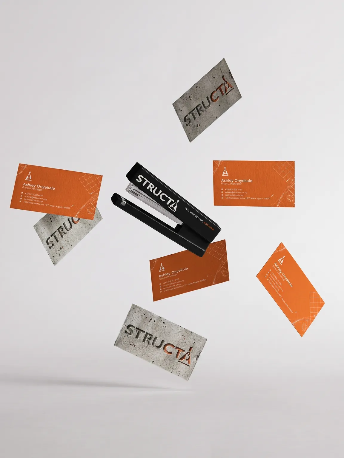 Structa business cards and branded stationery arranged on concrete